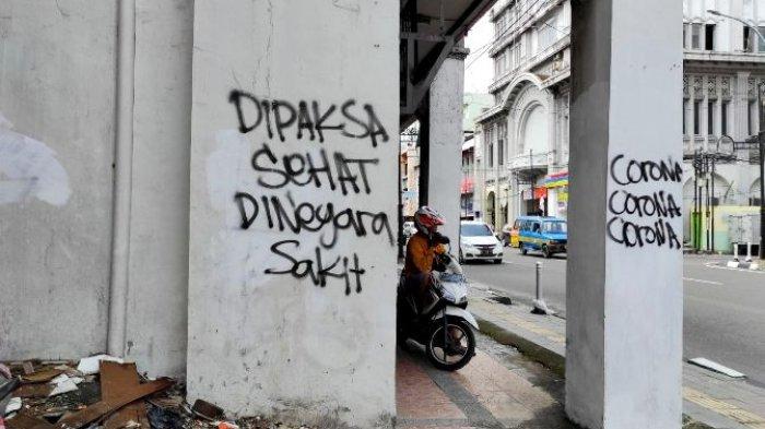 Mural Kritikan Mulai Muncul di Medan: Dipaksa Sehat di Negara Yang Sakit