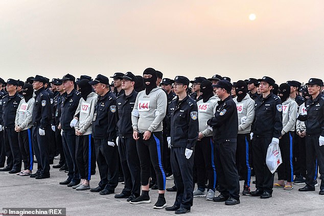 Hundreds of suspected telecom fraudsters are repatriated to China from Cambodia as Be