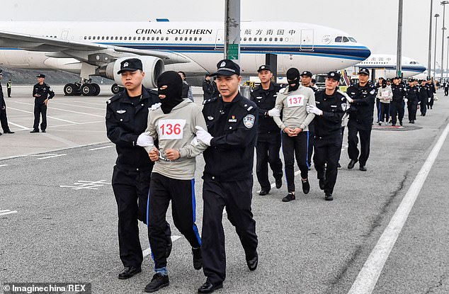 Hundreds of suspected telecom fraudsters are repatriated to China from Cambodia as Be
