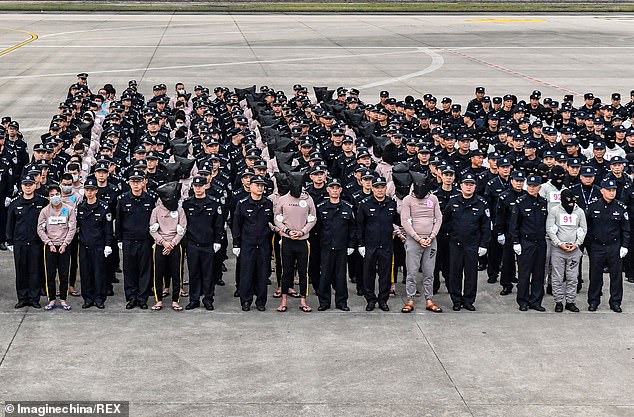 Hundreds of suspected telecom fraudsters are repatriated to China from Cambodia as Be