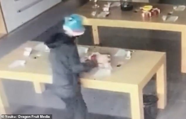 Dumb thief RUNS THROUGH shop's glass doors to steal eight smartphones without 