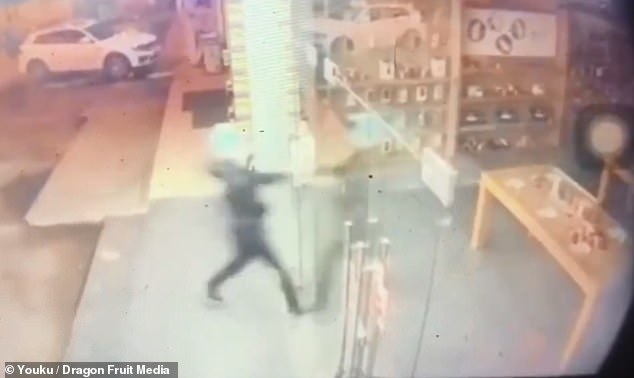 Dumb thief RUNS THROUGH shop's glass doors to steal eight smartphones without