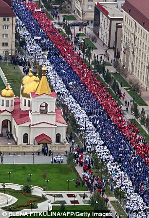 Happy birthday Mr President: Russians celebrate Putin's 62nd birthday with novelty T-