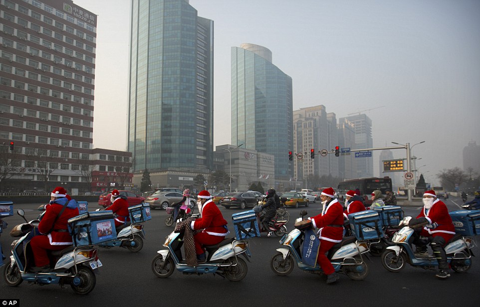 OMFG...Food delivery men dress themselves as Father Christmas in China !!!!!!