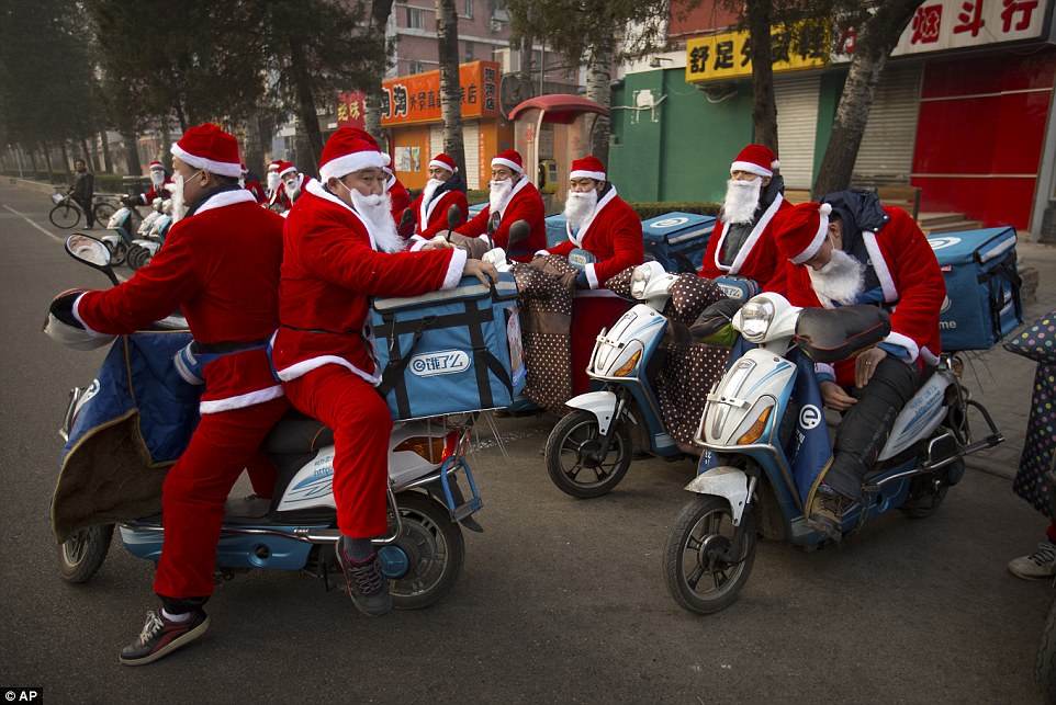 OMFG...Food delivery men dress themselves as Father Christmas in China !!!!!!
