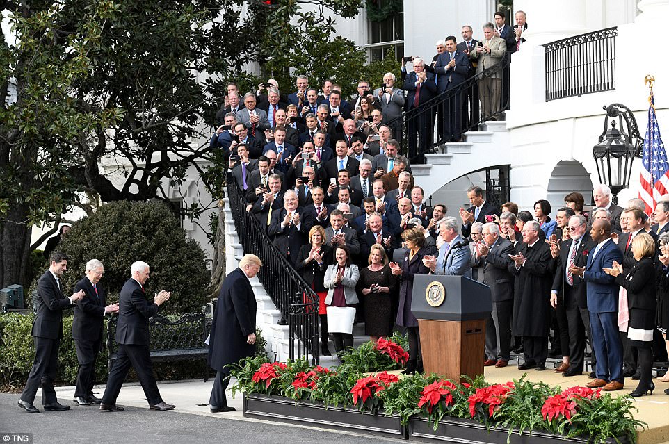 We are making America great again!': Trump hauls Republican lawmakers to the White