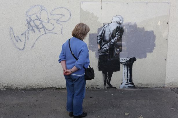 isis-vandalismbanksy-wall-art-vandalised-with-giant-penis-in-overnight-spray-paint