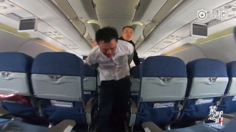 Flight attendant held hostage by armed passenger on Air China flight