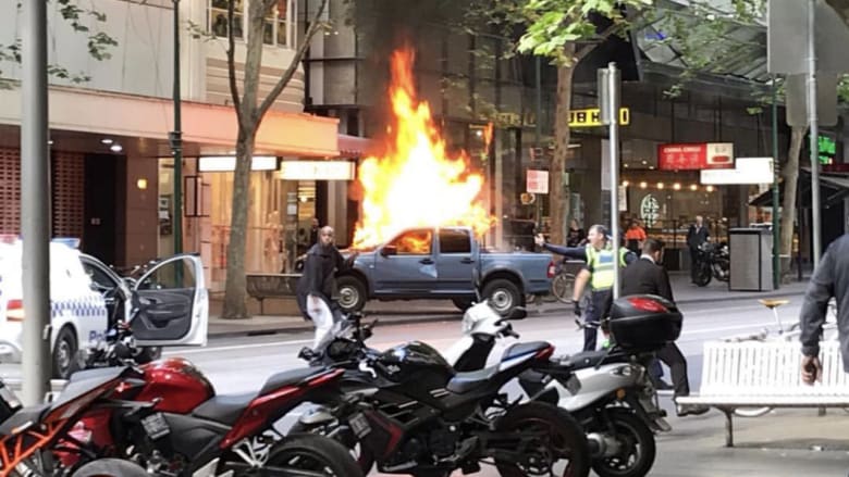 Bourke Street car explosion live: man shot after car bursts into flames on Bourke S